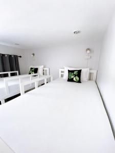 Postel nebo postele na pokoji v ubytování Khaolak Mind Home Hostel