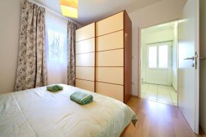Postel nebo postele na pokoji v ubytování Apartments Aster