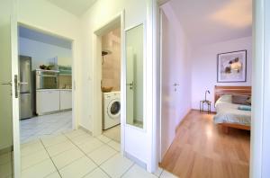 Kuchyň nebo kuchyňský kout v ubytování Apartments Aster