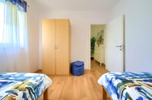Postel nebo postele na pokoji v ubytování Apartments Aster