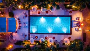 A television and/or entertainment centre at La Capria Suite Hotel Alacati