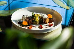 a plate of food in a bowl on a table at Hotel Villa Carlotta in Taormina