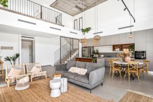 a living room with a couch and a table at Aria boutique villa in Kramim