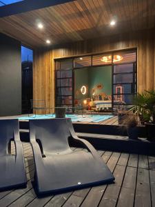 a house with a pool and a table and chairs at Chy conary in Carbis Bay