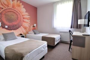 Postelja oz. postelje v sobi nastanitve Relais Fasthotel Port Lauragais