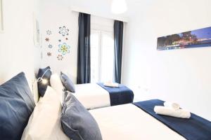 A bed or beds in a room at Letmalaga Popolo & Parking