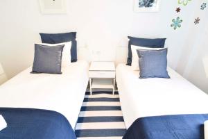 A bed or beds in a room at Letmalaga Popolo & Parking
