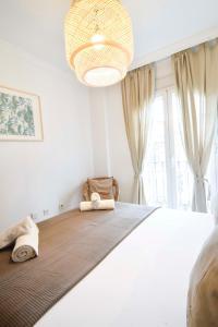 A bed or beds in a room at Letmalaga Popolo & Parking