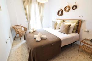 A bed or beds in a room at Letmalaga Popolo & Parking
