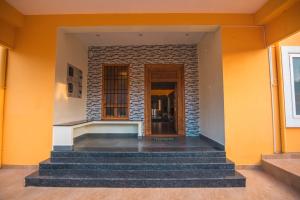 a building with stairs in front of a building at Saffron Vilva in Pondicherry