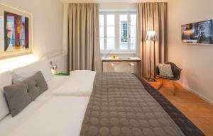 Postelja oz. postelje v sobi nastanitve Hotel Rössli