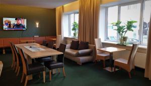 TV a/nebo společenská místnost v ubytování myMINGA13 - Hotel & serviced Apartments