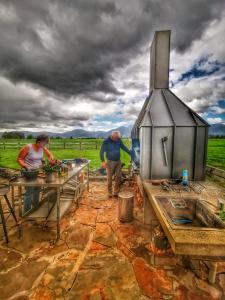 a group of people preparing food in a kitchen at housewithnonails in Matamata