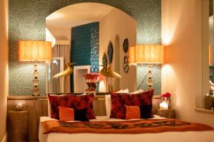 A bed or beds in a room at La Capria Suite Hotel Alacati