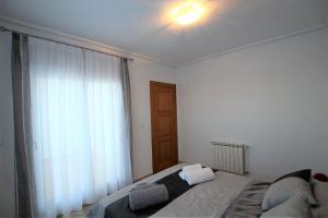 Postel nebo postele na pokoji v ubytování Adosado Roldán by Rental Olé