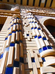 a close up of the side of a building with windows at Colibri Traditional Hostel in Samarkand