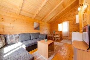 a living room with a couch and a table at KATANA VILLAGE APARTMENT in Ulcinj