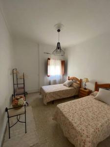 Postel nebo postele na pokoji v ubytování Vivienda rural Mogón - Los Senderos