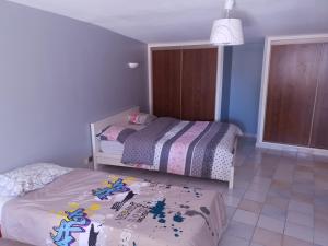 Posteľ alebo postele v izbe v ubytovaní Les Bruyères