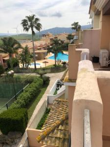 a view from the balcony of a resort with a swimming pool at BRISA DE ZAHARA - Casa para familia con piscina y garaje en Urb. privada in Zahara de los Atunes