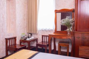 Postel nebo postele na pokoji v ubytování Duc Vuong Saigon Hotel - Bui Vien