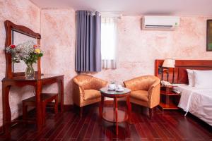 Postel nebo postele na pokoji v ubytování Duc Vuong Saigon Hotel - Bui Vien