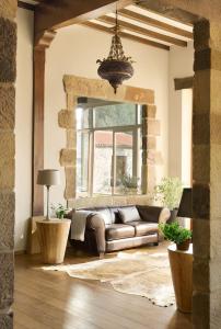 a living room with a couch and a window at LA POSADA in Silió