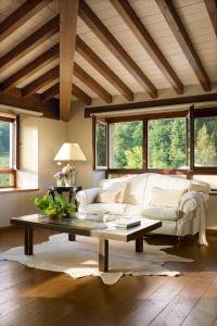 a living room with a white couch and a coffee table at LA POSADA in Silió