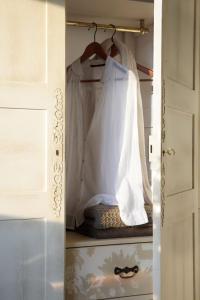 a closet with a white shirt and a curtain at LA POSADA in Silió