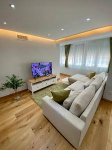 Ein Sitzbereich in der Unterkunft Apartamentos Prestige Málaga Suites