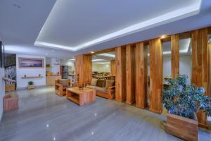 a living room with a couch and a table at Aabas Pokhara by Barahi Hospitality in Pokhara