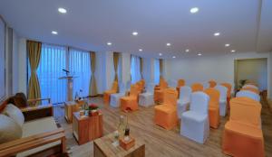 a room with a bunch of chairs in a room at Aabas Pokhara by Barahi Hospitality in Pokhara