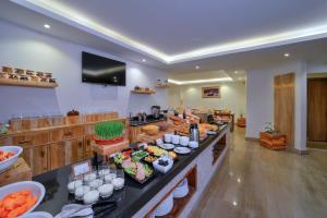 a buffet in a hotel room with food on display at Aabas Pokhara by Barahi Hospitality in Pokhara