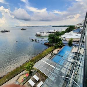 a view of the water from a building at One Residence Batam Unit 3AB in Batam Center