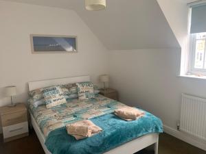 Легло или легла в стая в Dream Weaver 2 Bedroomed cottage on The Bay, Filey with on-site gym and swimming pool