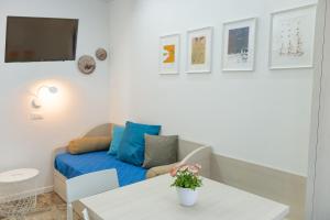 a living room with a couch and a table at EDEN CONERO Appartamento IL PORTO - NUMANA CENTRO in Numana