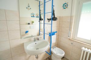 a bathroom with a sink and a toilet at EDEN CONERO Appartamento IL PORTO - NUMANA CENTRO in Numana