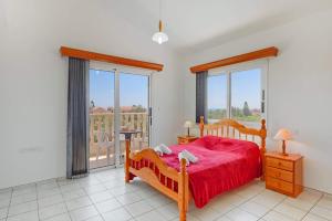 a bedroom with a bed and a large window at Villa Semeli by Villa Plus in Peyia +21 photos