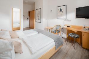 Ein Bett oder Betten in einem Zimmer der Unterkunft Hotel Künstlerhaus