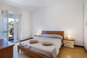 Ένα ή περισσότερα κρεβάτια σε δωμάτιο στο Iris Apartment Lago Maggiore +15 φωτογραφίες