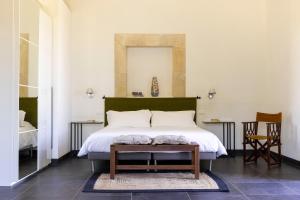 Postel nebo postele na pokoji v ubytování Masseria del Carrubo + 37 fotografií