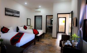 Postel nebo postele na pokoji v ubytování Green Grapefruit Villa