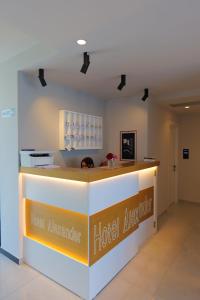 a reception counter at a hotel avalanche hotel appliance at Hotel Alexander in Ksamil