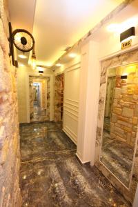 a hallway of a building with a stone wall at REN PLUS SUITES in Istanbul