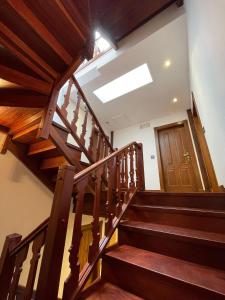 a staircase in a building with a skylight at Apartamento del s XVI en el casco histórico de Luanco in Luanco