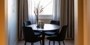 a dining room with a table and chairs and a window at Thon Partner Hotel Backlund in Levanger