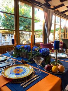 a table with plates and utensils on top at istifci in Izmir