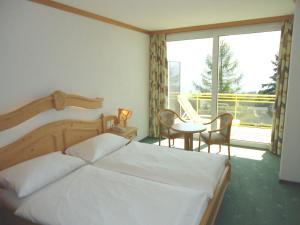 Postel nebo postele na pokoji v ubytování Grand Hôtel du Parc