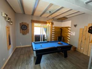 a billiard room with a pool table in it at « Dans les nuages » in Oderen