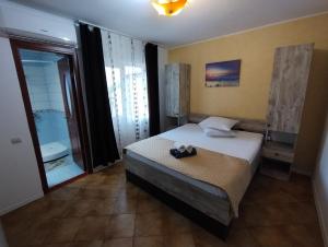 Postel nebo postele na pokoji v ubytování Casa Aura Costinești